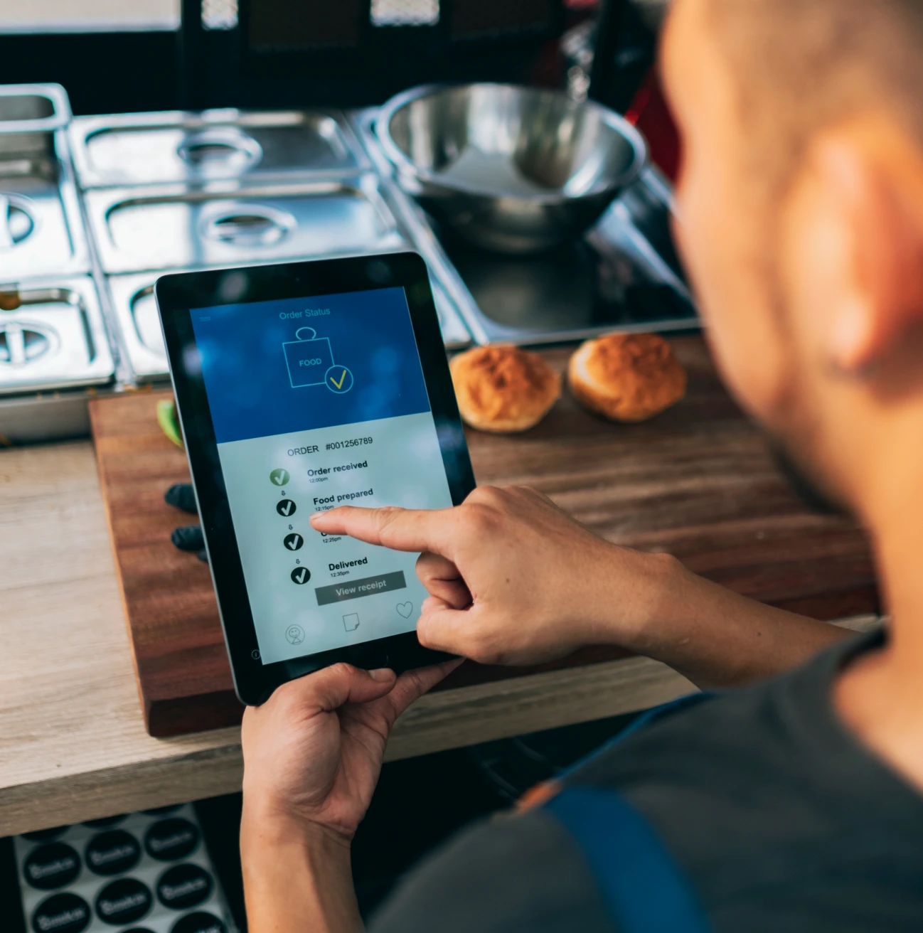 Chef using tablet in kitchen