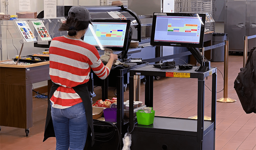 Cashier using touchscreen register system