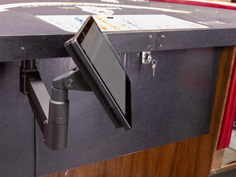 Adjustable tablet arm on gaming table