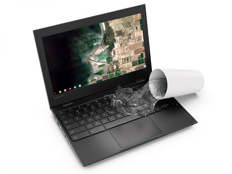 Cup tipping water onto computer